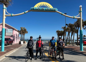 Four cyclists arriving in New Smyrna Beach